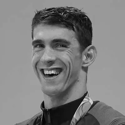 Athlète olympique souriant qui porte une médaille — le sport offre à bien des personnes TDAH un exutoire puissant